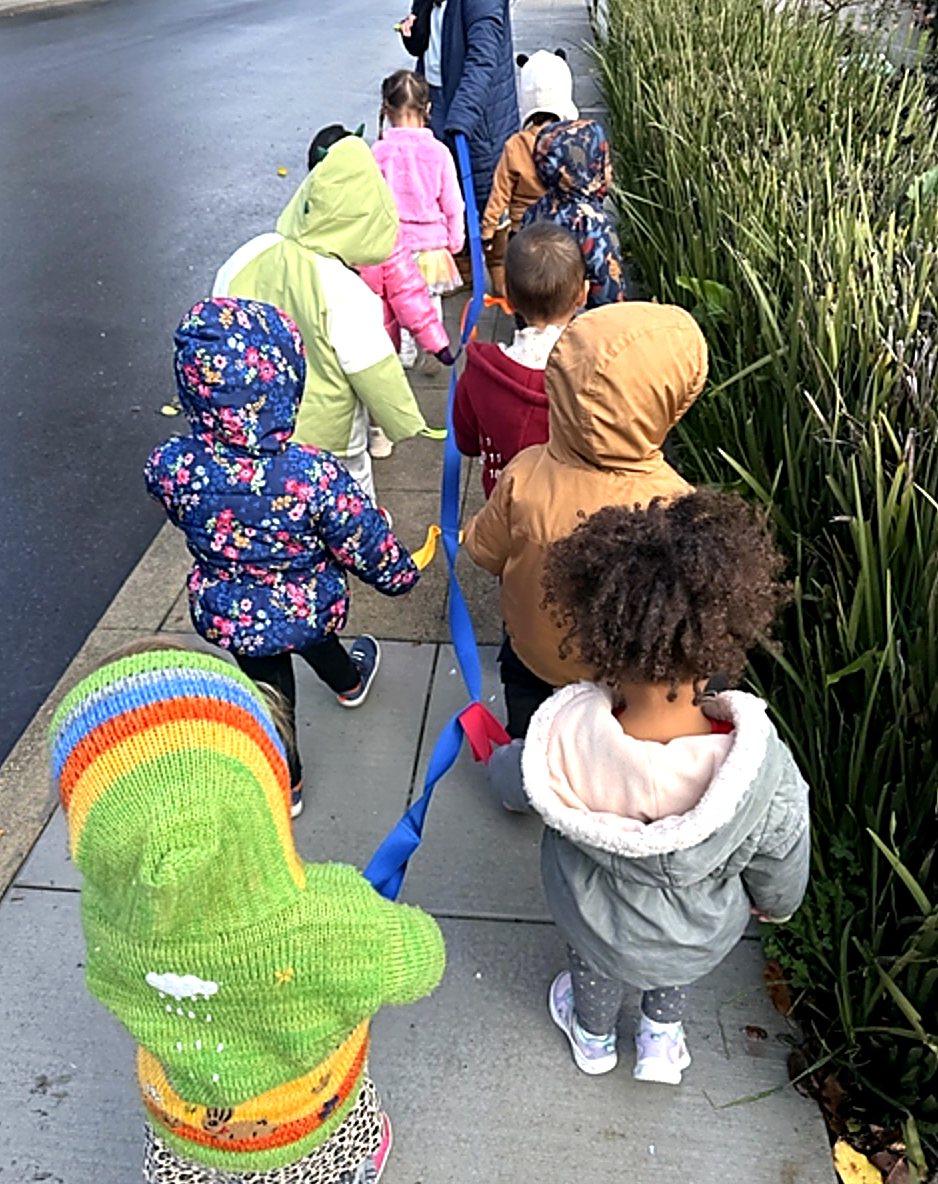 Little Oak children walking together outdoors